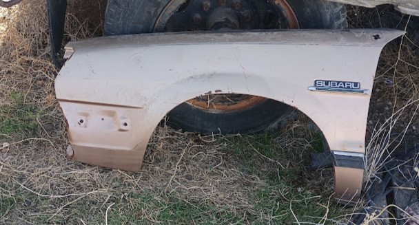 1982 SUBARU BRAT DRIVER FENDER ORIGINAL W/ EMBLEM Original driver's side (left) fender for 1982 Subaru Brat with genuine Subaru emblem still attached. This hard-to-find body panel shows rust damage particularly around the wheel well and lower areas, but retains its original Subaru badge. Suitable for restoration or parts. Classic Brat fender from the iconic pickup truck era. Salvage part for restoration projects. Sold as-is for restoration. #SubaruBrat #1982Subaru #BratFender #SubaruParts #VintageParts #ClassicSubaru #AutoSalvage #RestorationParts #DriverFender #SubaruEmblem #BratRestoration #VintageSubaru #BodyPanels #ClassicCars #SalvageParts